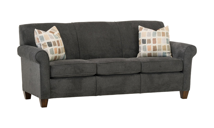 Gray sofa with patterned pillows on a white background